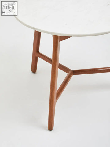 Myan round side table with white marble round top and light brown acacia wood legs for minimalist spaces