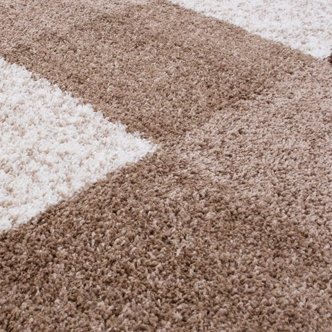 A plush high-pile brown rug with a beige and cream geometric pattern from myshaggy geometric brown collection