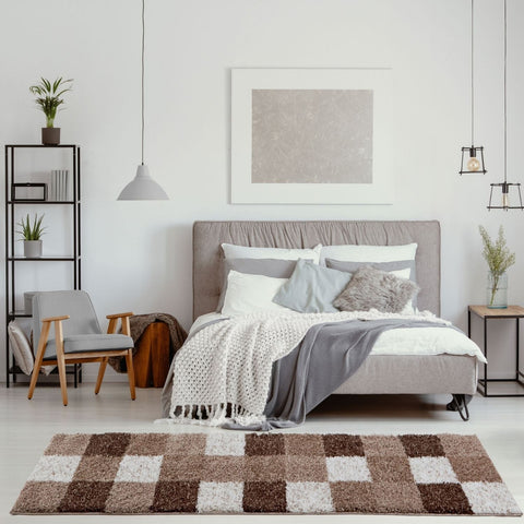 A plush rectangular myshaggy geometric brown rug with a soft texture and alternating brown and beige squares pattern
