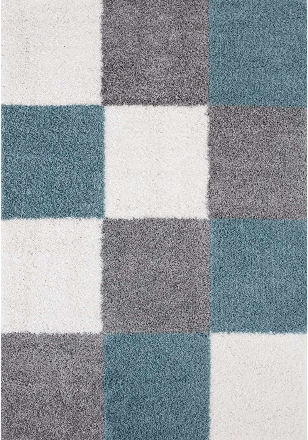 A plush myshaggy geometric area rug with a modern checkered duck egg blue gray and white pattern