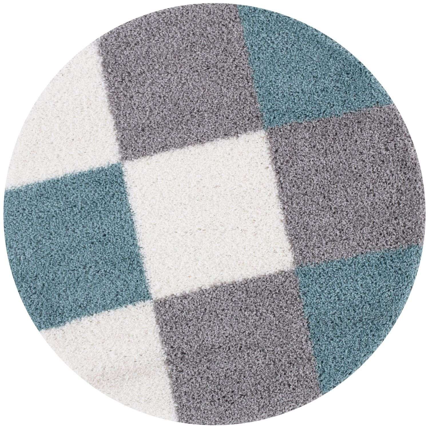 Circular shag rug with a geometric pattern of gray teal and duck egg blue squares perfect for cozy spaces