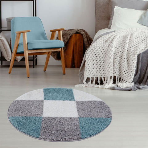 Circular myshaggy geometric rug with plush shaggy texture and duck egg blue checkerboard pattern
