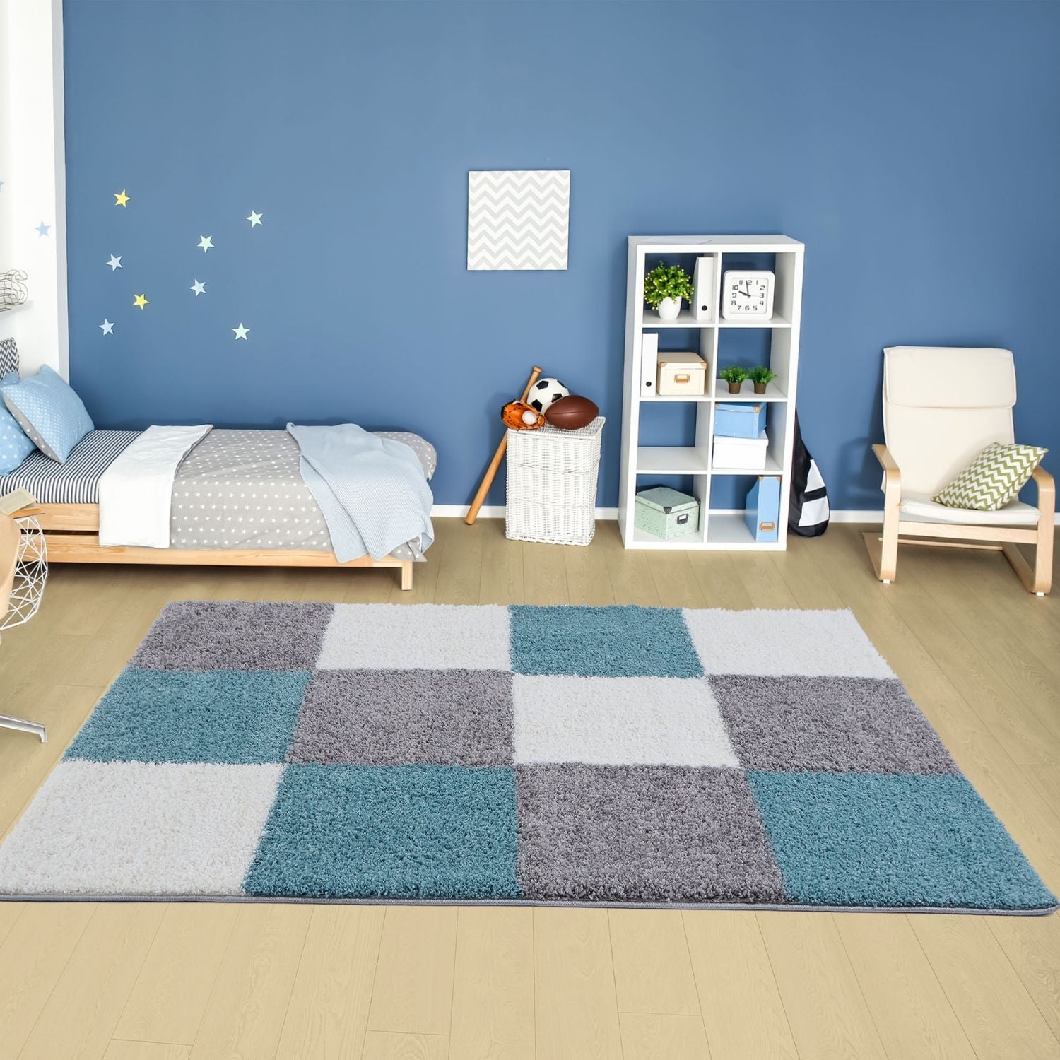 A plush rectangular area rug with a duck egg blue patchwork design in teal gray and white called myshaggy geometric rug