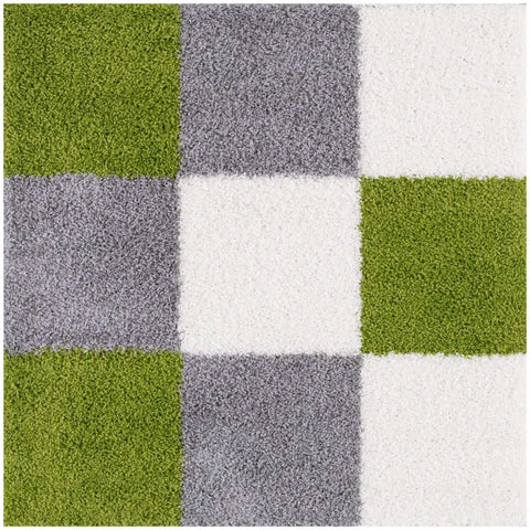 A plush high pile myshaggy geometric green rug with olive green gray and white squares in a modern pattern