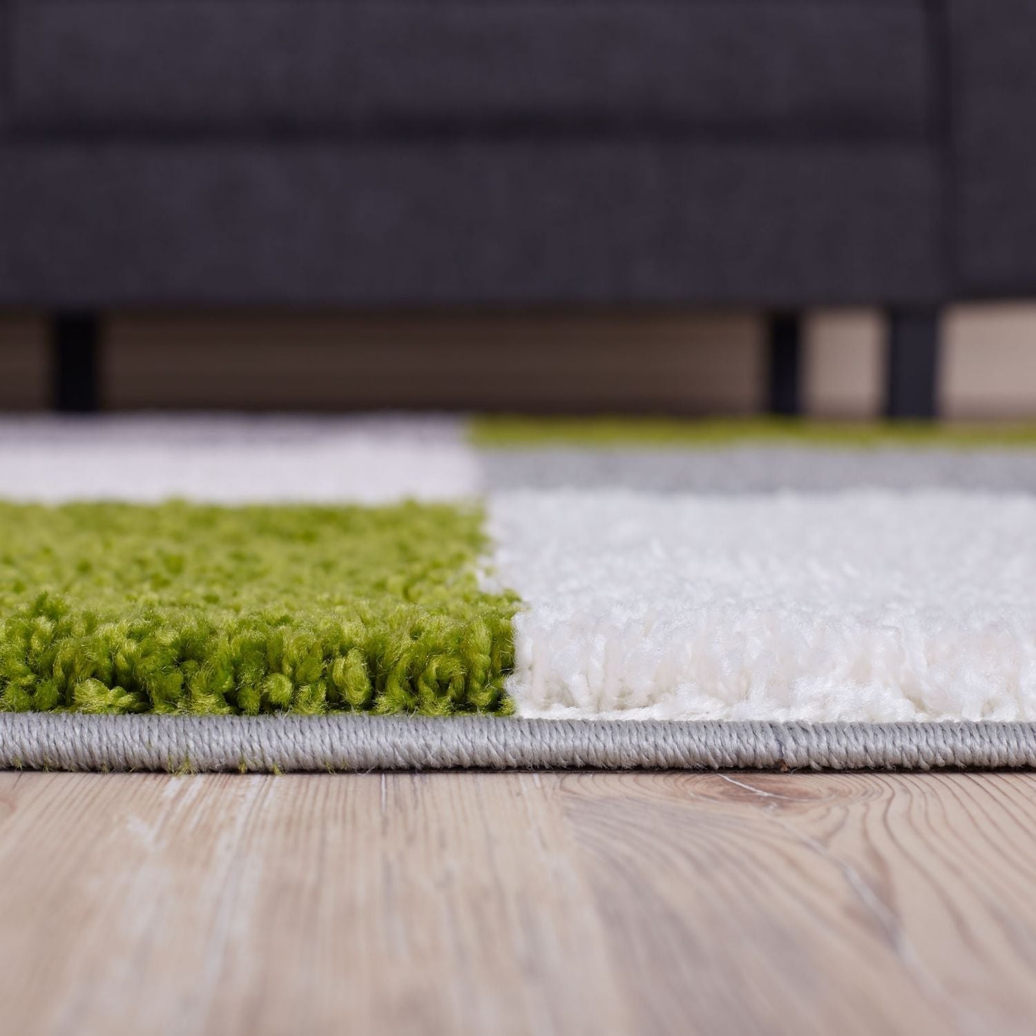 A plush myshaggy geometric green rug with vibrant lime and white blocks soft shaggy texture and gray border