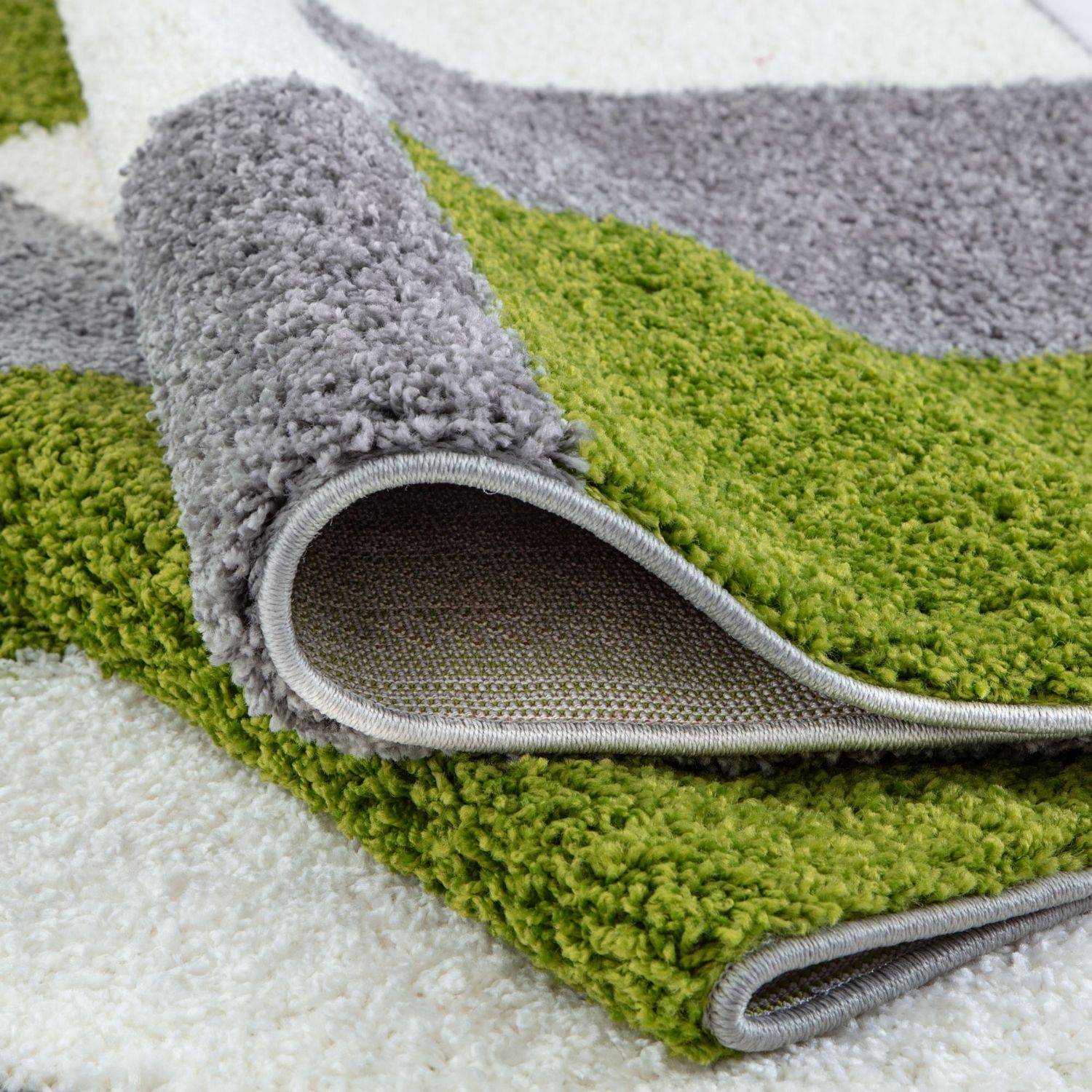 A plush shaggy myshaggy geometric green rug with a modern vibrant green and soft gray geometric pattern