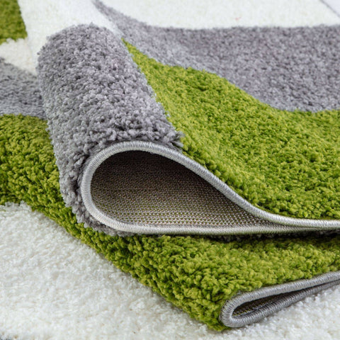 A plush shaggy myshaggy geometric green rug with a modern vibrant green and soft gray geometric pattern