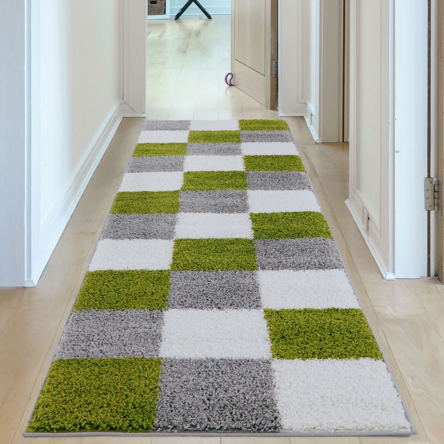 A plush shaggy runner rug in vibrant green gray and white checkerboard pattern called myshaggy geometric green rug