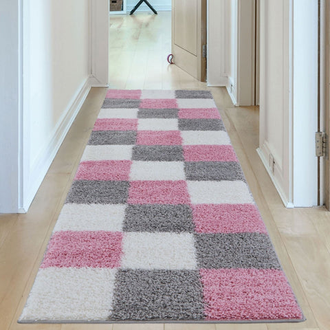 A plush shaggy runner rug with a geometric pink checkerboard pattern perfect for cozy spaces myshaggy geometric pink
