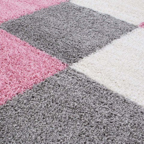 A plush myshaggy geometric pink rug with soft texture and pink gray white square pattern for cozy spaces