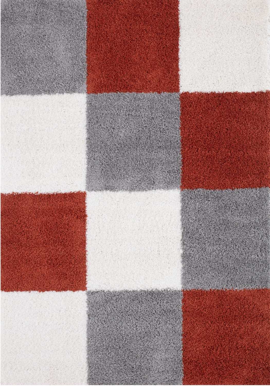 A plush myshaggy geometric terra rug with a modern red gray and white checkered pattern perfect for any room