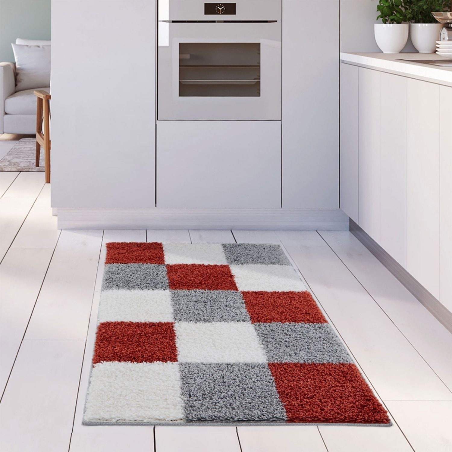 A plush rectangular kitchen rug with red white and gray geometric squares from myshaggy geometric terra collection