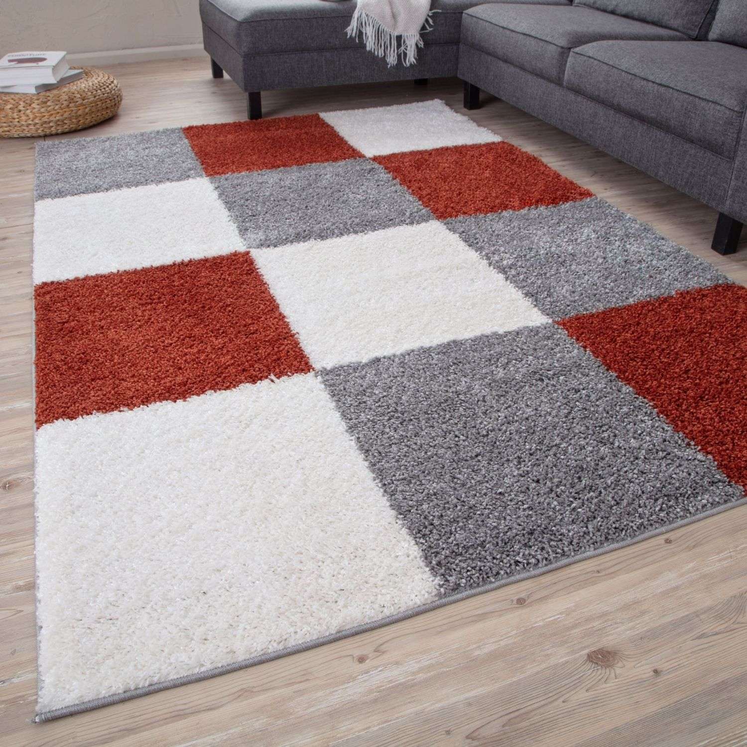 A plush shaggy area rug with a bold red white and gray geometric patchwork design called myshaggy geometric terra rug