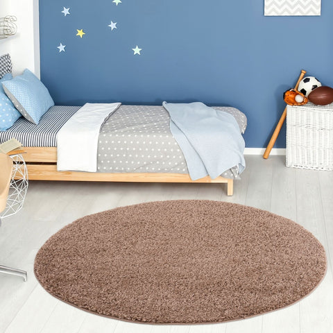 Brown oval-shaped shaggy myshaggy solid beige rug perfect as a cozy solid beige rug for any room