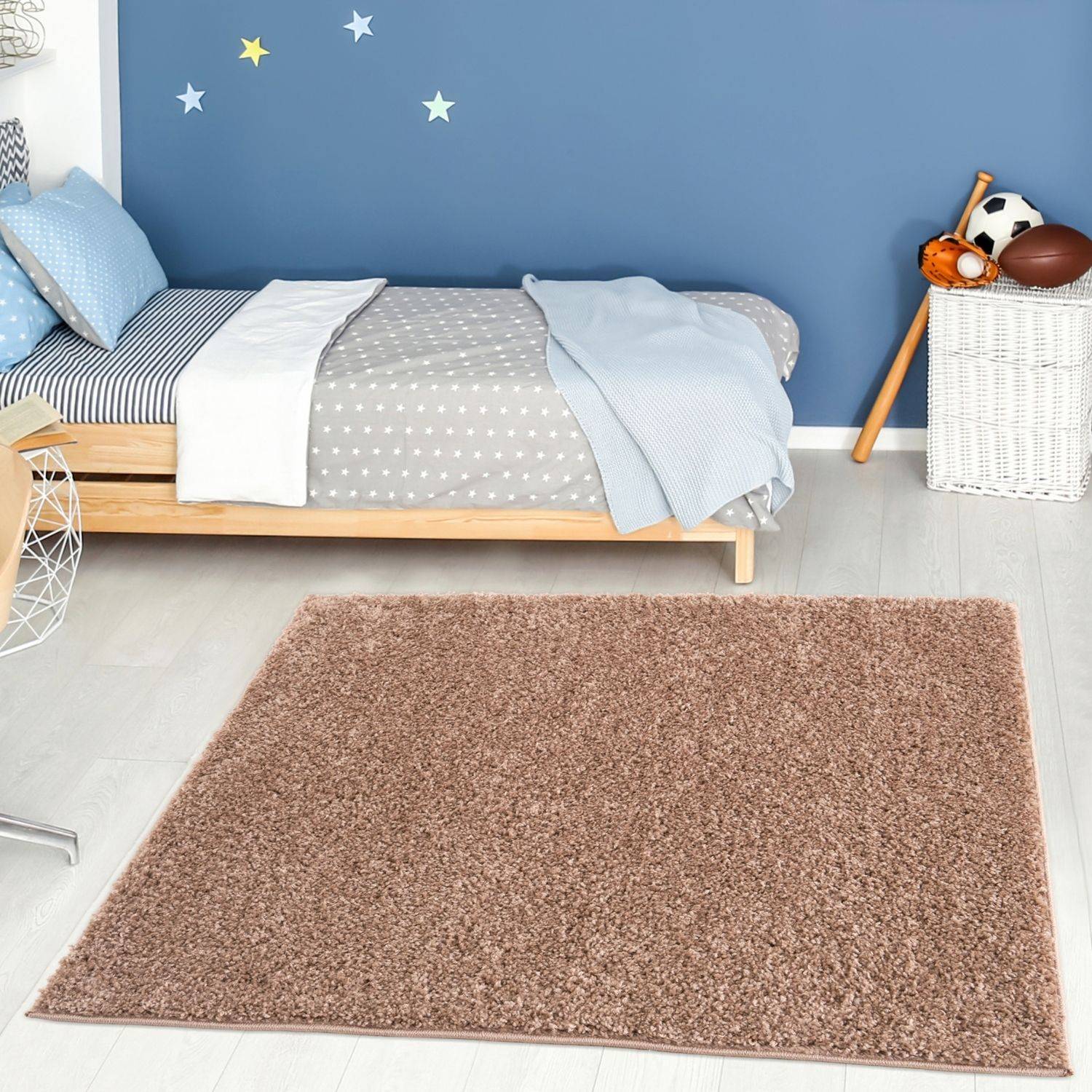A plush rectangular myshaggy solid beige rug with a soft textured surface perfect as a cozy beige rug