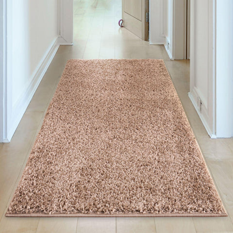 Beige rug myshaggy solid beige with a plush textured surface and neatly finished edges in a rectangular shape