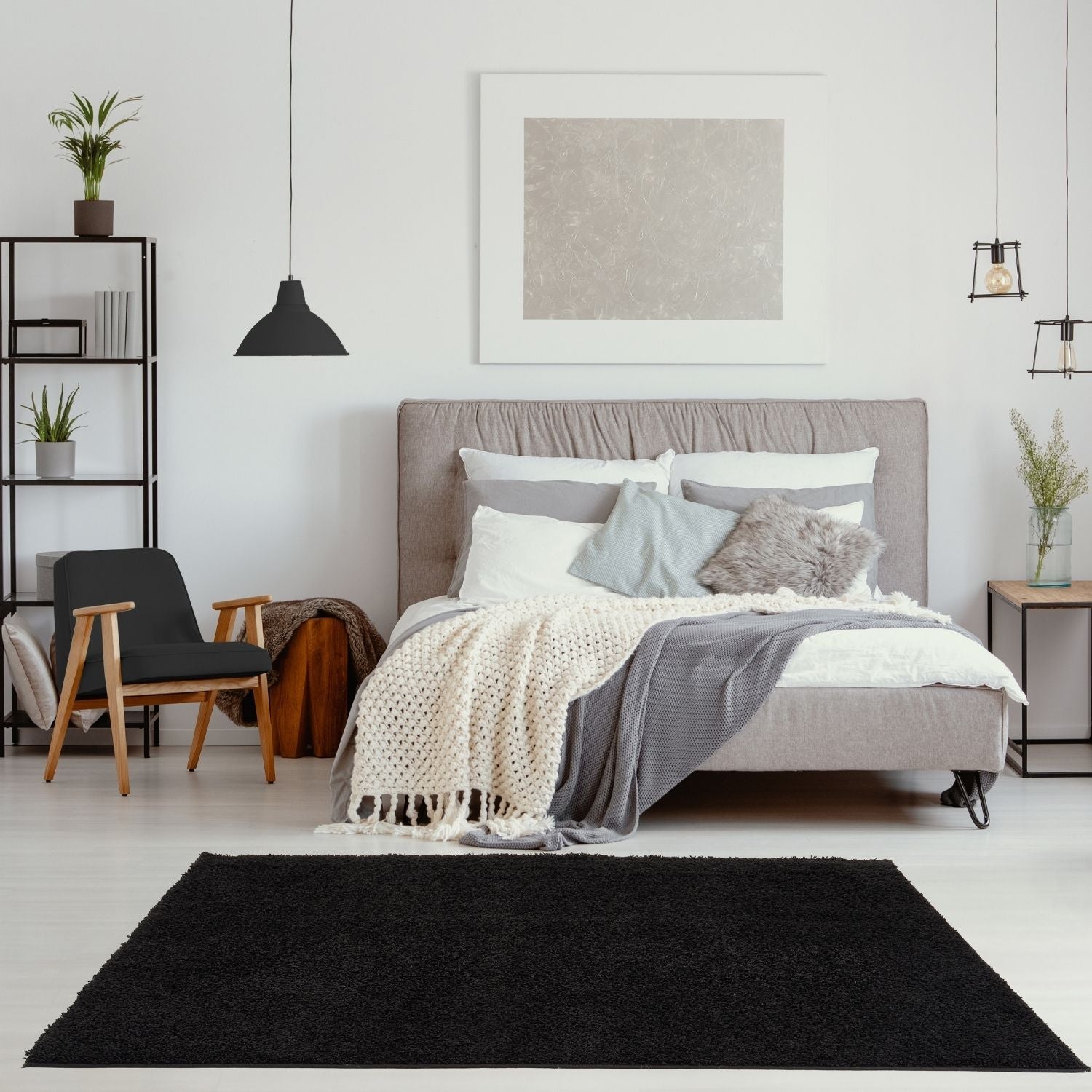 Black shaggy area rug from myshaggy solid black collection featuring soft plush texture and deep solid black color