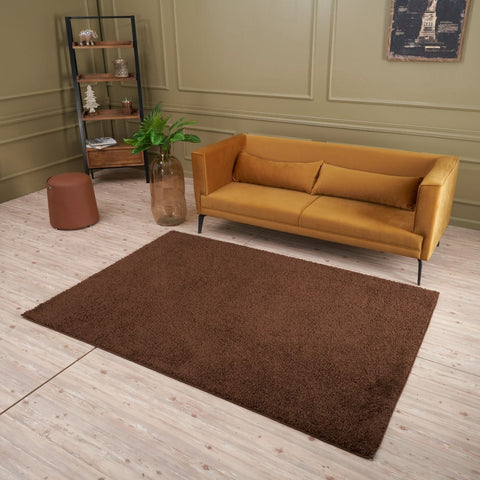 A plush soft brown rug from myshaggy solid brown collection with a rectangular shaggy texture perfect for cozy spaces