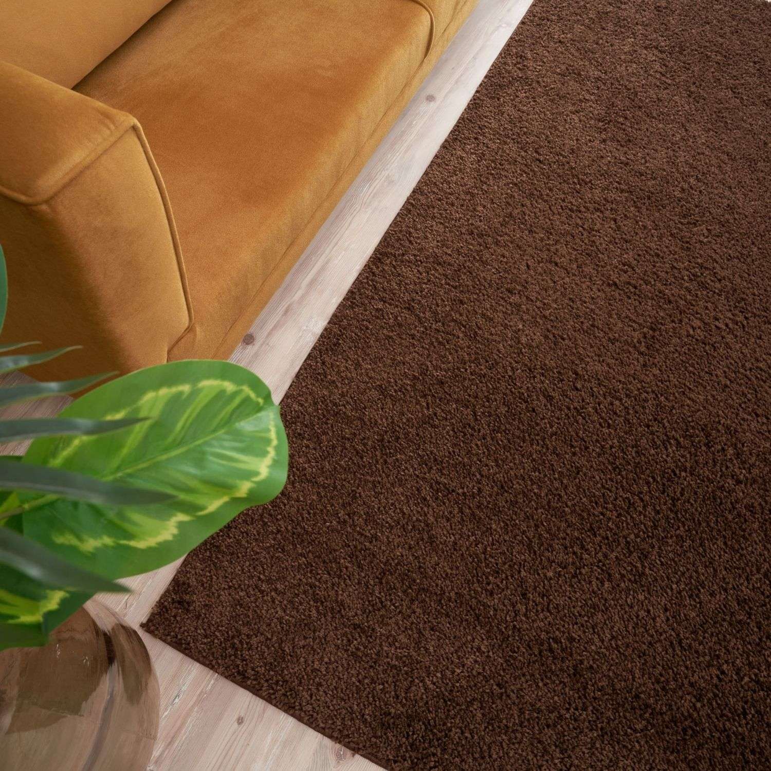 Rich brown shaggy area rug with plush textured surface perfect as a myshaggy solid brown rug or solid brown rug
