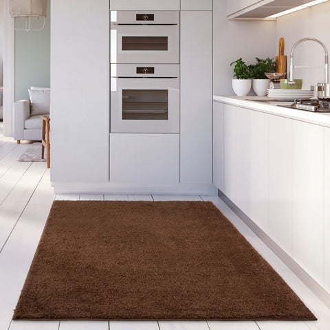 Brown rug with plush textured surface from myshaggy solid brown rug collection perfect for cozy spaces