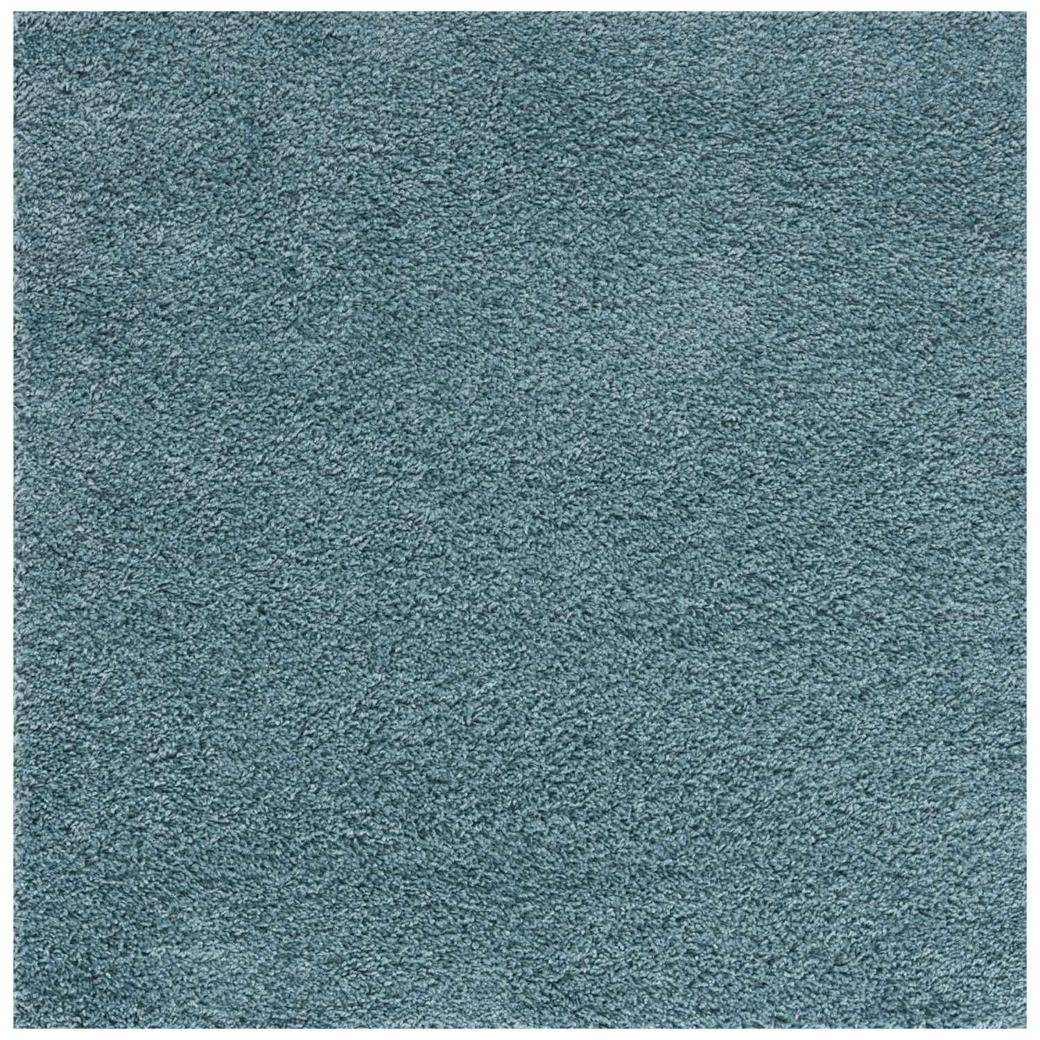 A plush textured teal shag rug with soft uniform pile in duck egg blue perfect for cozy home decor
