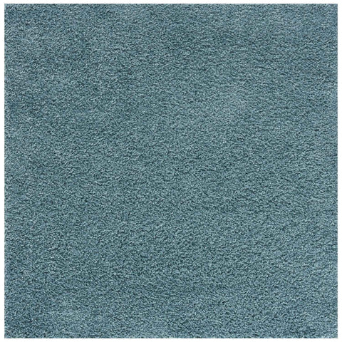 A plush textured teal shag rug with soft uniform pile in duck egg blue perfect for cozy home decor