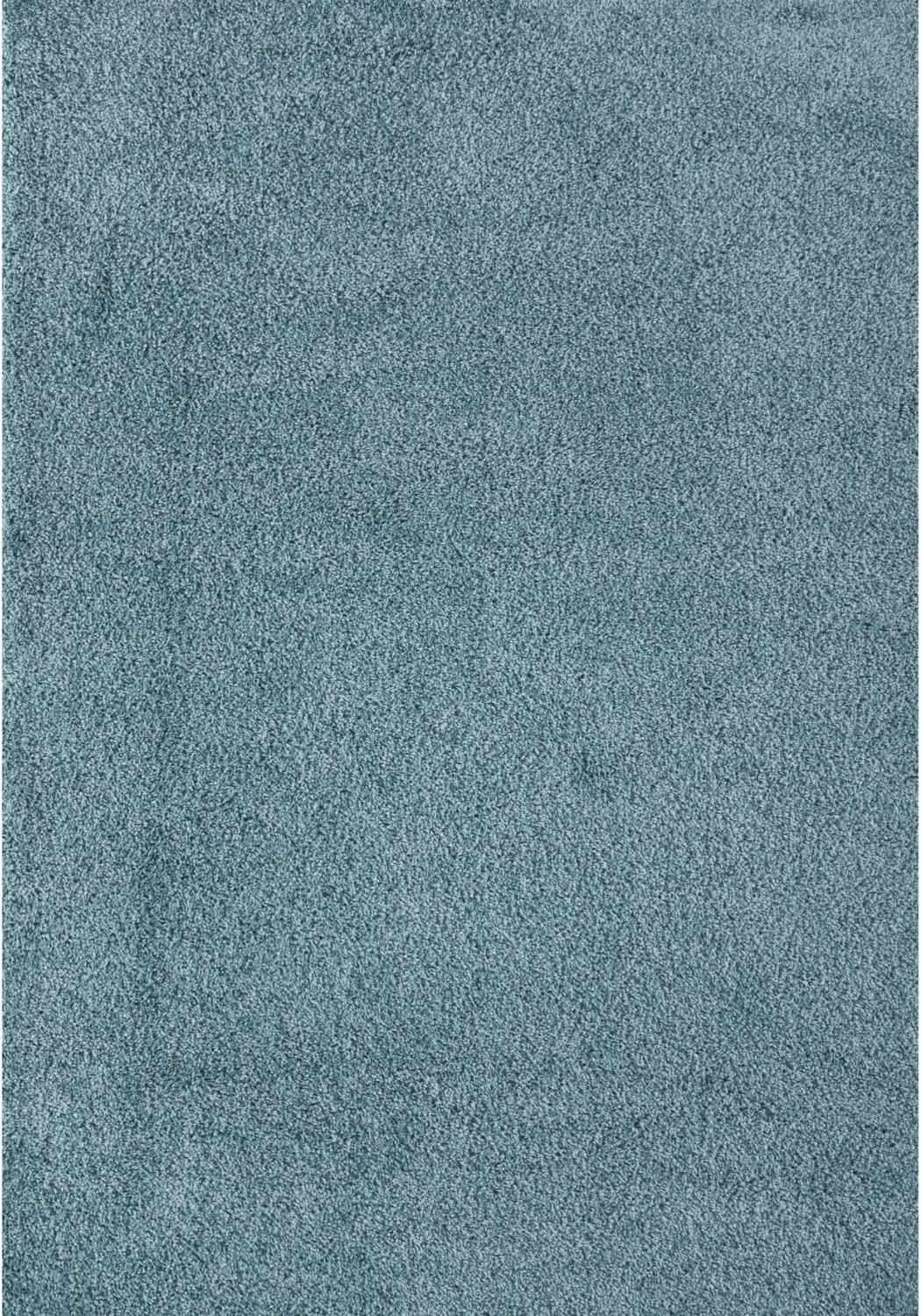 A plush teal shag rug with a soft textured surface in duck egg blue perfect for cozy rooms and decor
