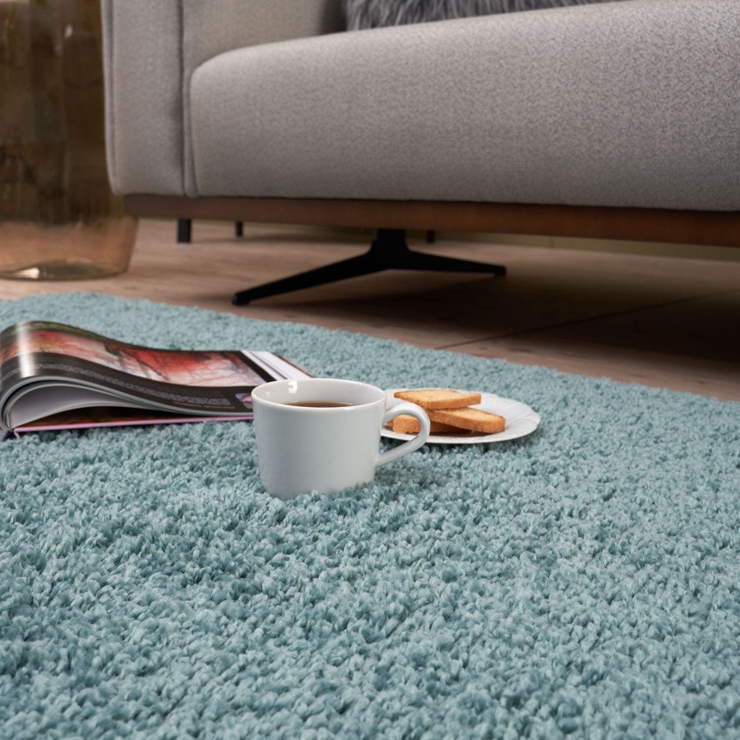 A plush light blue shaggy rug with a soft textured surface perfect as a duck egg blue egg blue rug