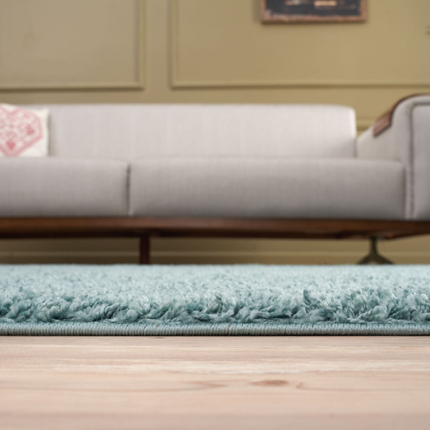 A plush light teal duck egg blue shag rug with a soft textured surface and neatly finished edges perfect for cozy spaces