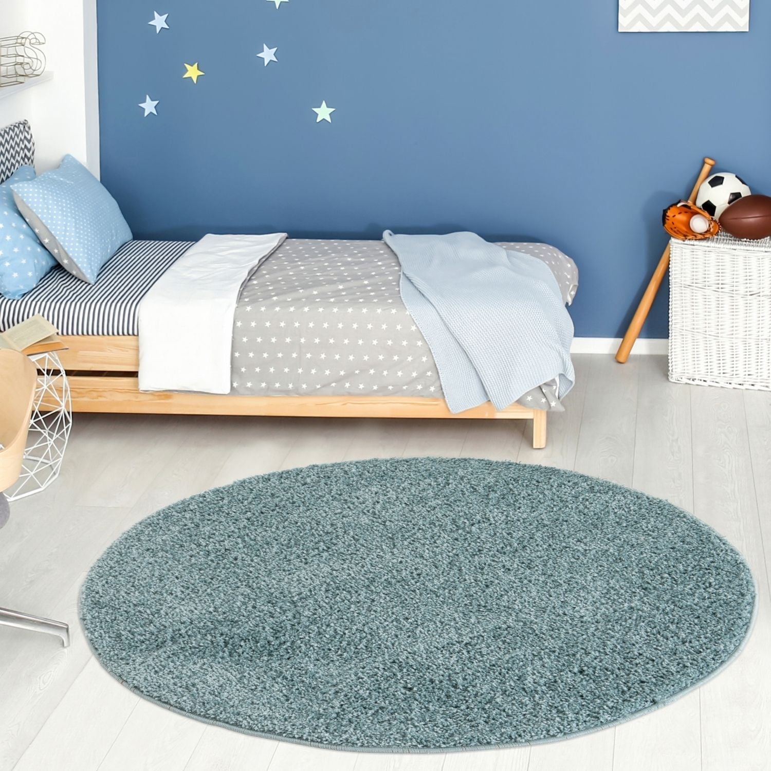 A plush round duck egg blue shag rug with a soft textured surface perfect for cozy home spaces