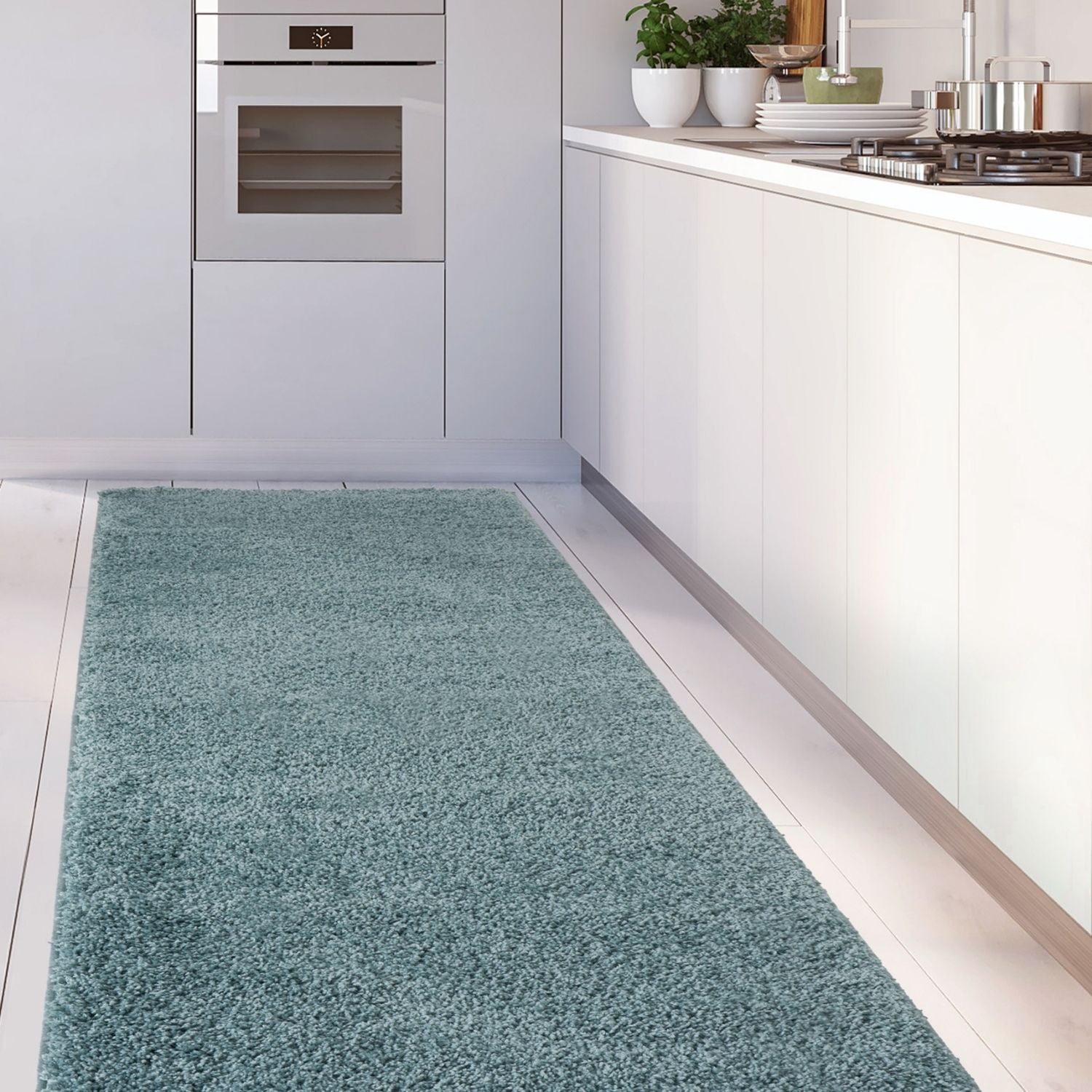 A plush teal duck egg blue shaggy rug adds cozy texture to the kitchen floor perfect for home comfort