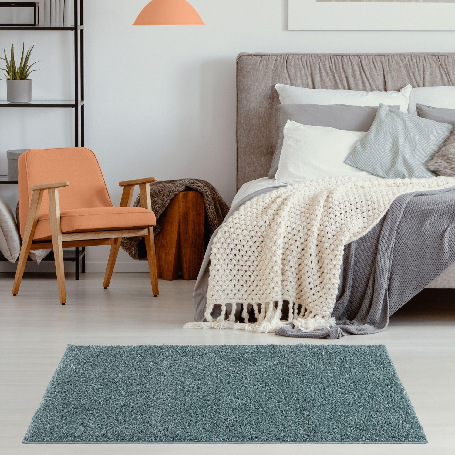 A plush duck egg blue shag rug with a soft textured surface perfect for cozy room decor