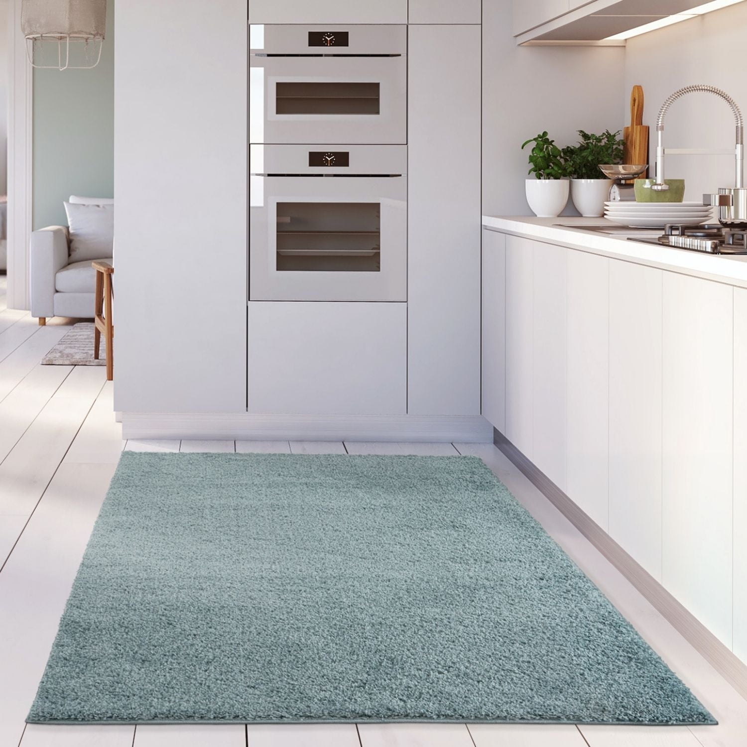 A plush duck egg blue shaggy area rug with soft textured surface on white tiled floor perfect for cozy spaces