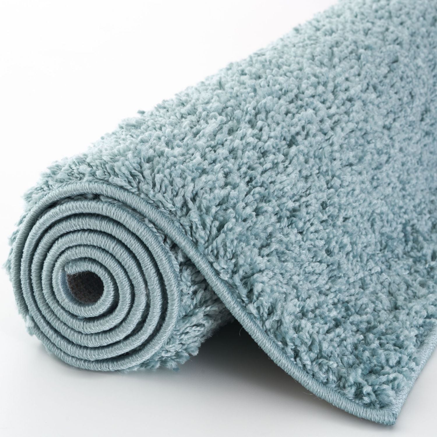A soft plush bath mat in duck egg blue with dense shaggy texture and neatly finished edges myshaggy solid rug