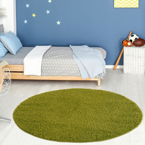 Olive green oval plush rug with plush 30mm pile from myshaggy solid green collection for cozy decor