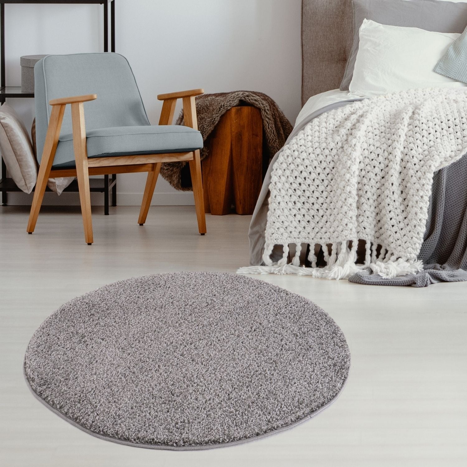 Gray circular shag rug with soft plush texture and raised edges from myshaggy solid grey collection