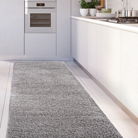A plush medium gray shaggy runner rug with a soft textured surface for kitchen floors myshaggy solid grey rug