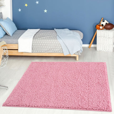 Pink shaggy area rug by Myshaggy solid pink featuring soft plush material perfect for cozy home decor