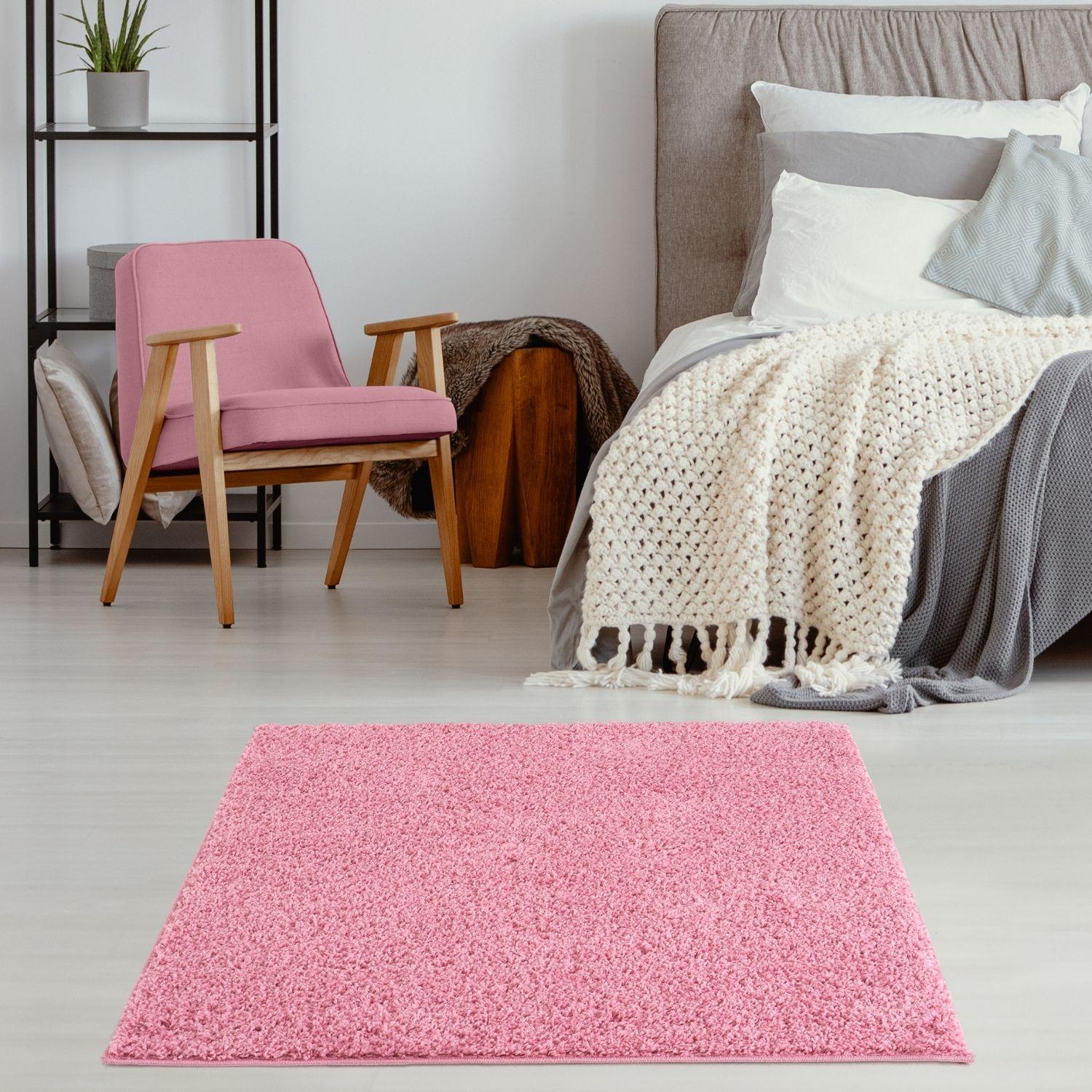 A myshaggy solid pink shaggy rectangular rug perfect for adding soft texture and bright color to any room