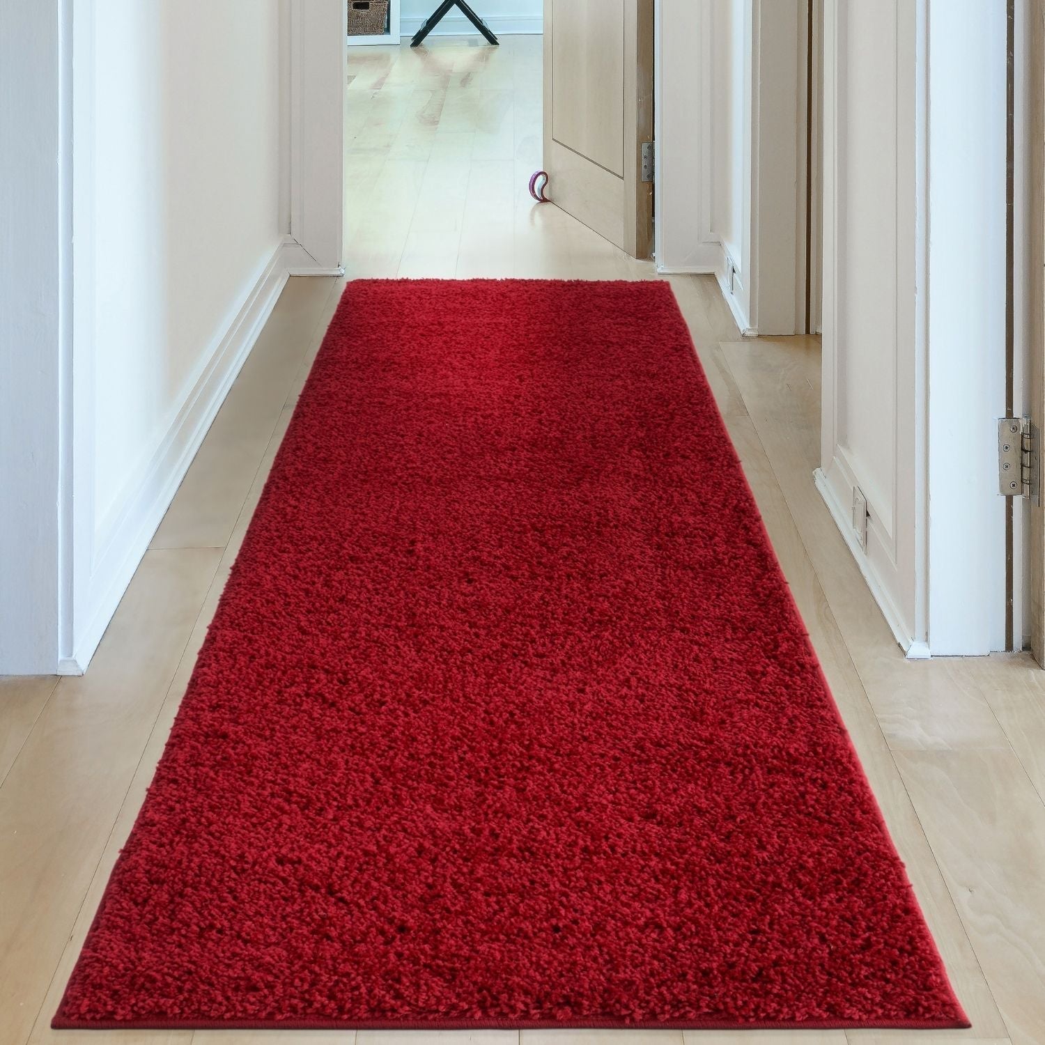 A plush myshaggy solid red rectangular hallway rug with a soft shaggy texture perfect for cozy spaces