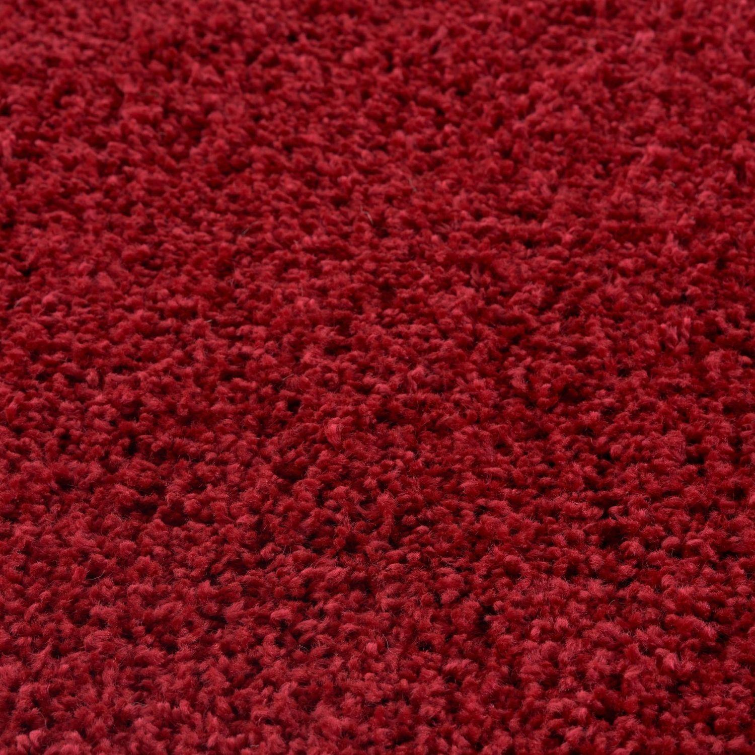 Myshaggy solid red rug with a rich crimson color and plush shaggy textured surface for cozy home style