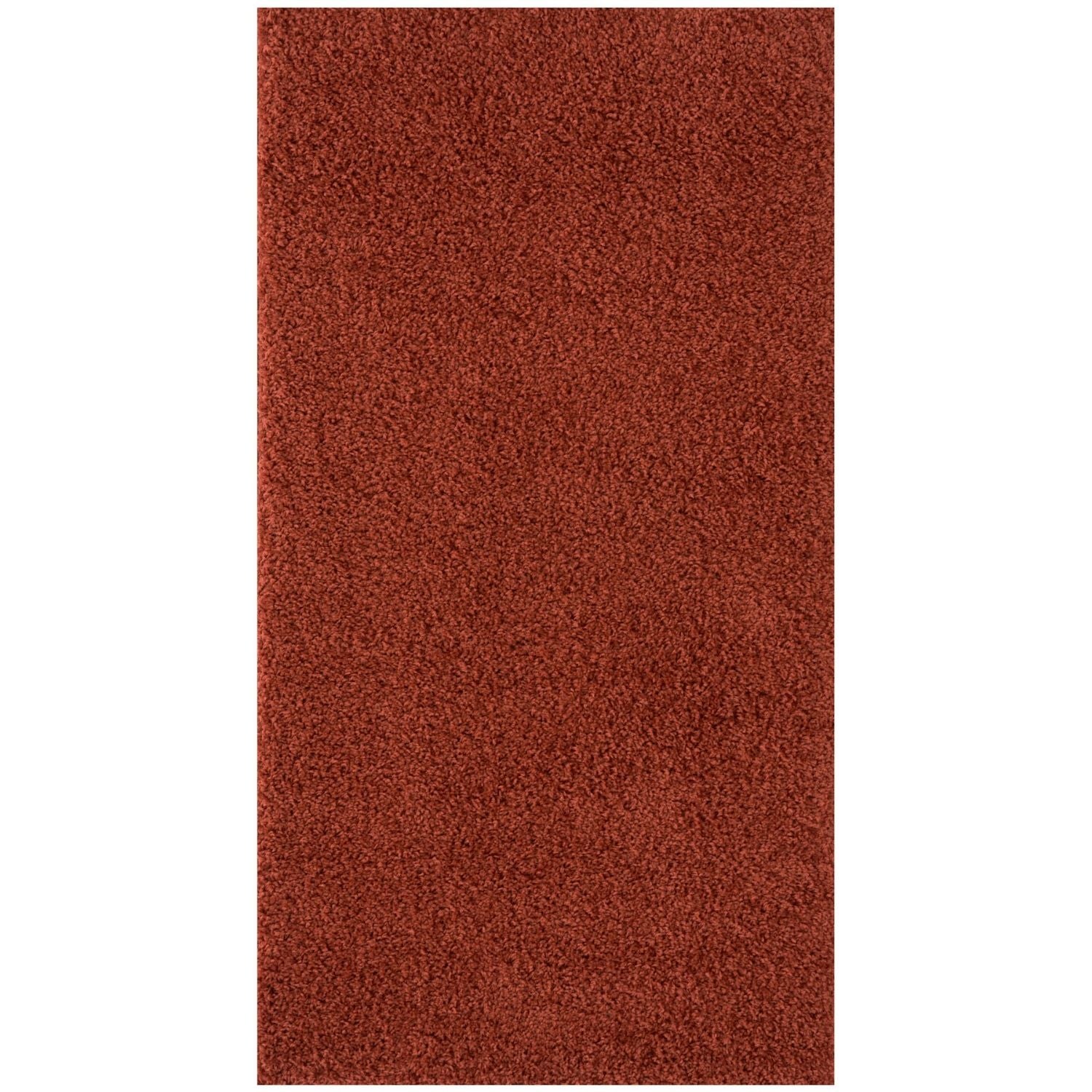 A plush deep rust colored shag rug with a dense texture from myshaggy solid terra solid terra rug collection
