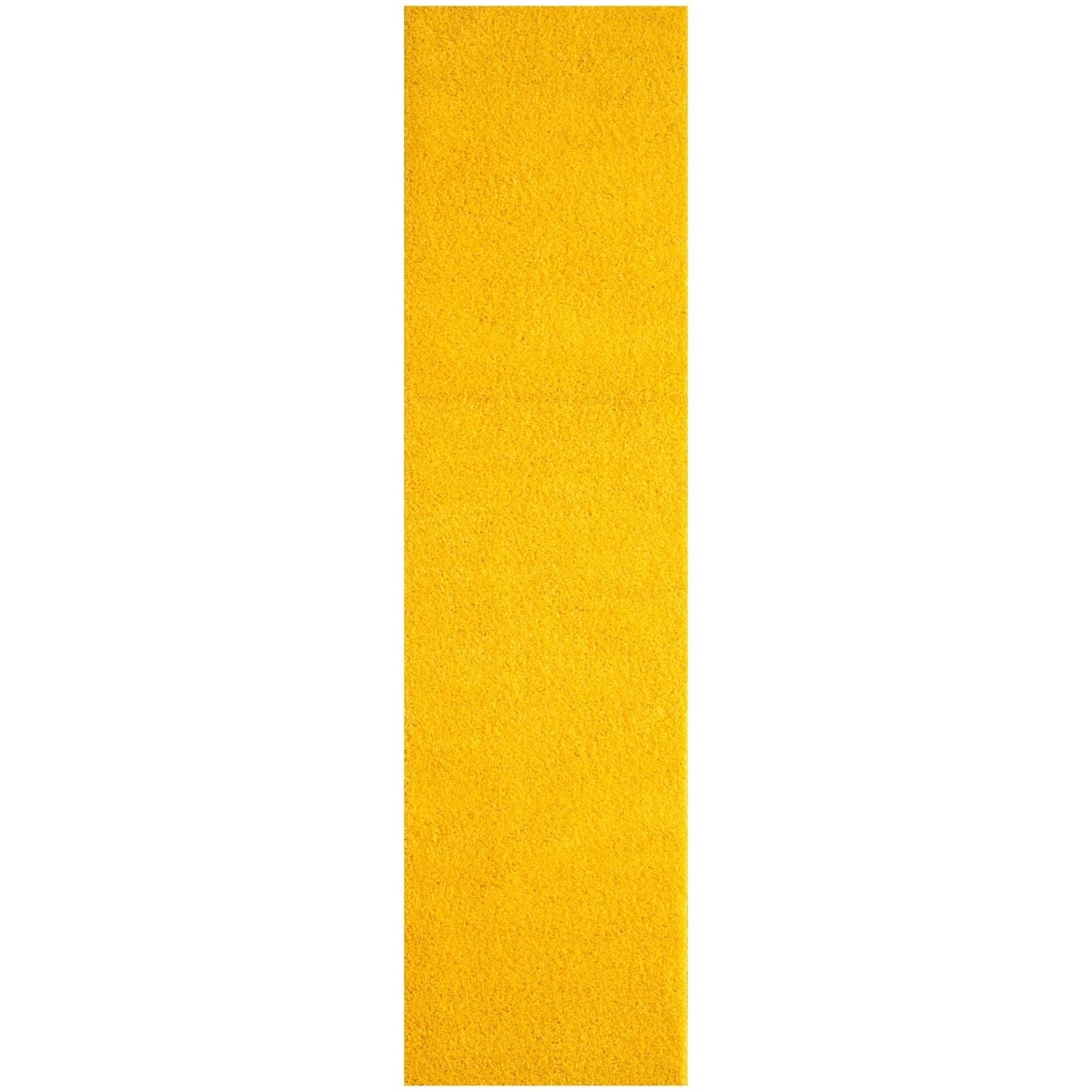 A vibrant solid yellow rug strip with textured grip tape detail from myshaggy solid yellow collection