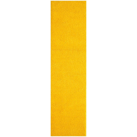 A vibrant solid yellow rug strip with textured grip tape detail from myshaggy solid yellow collection