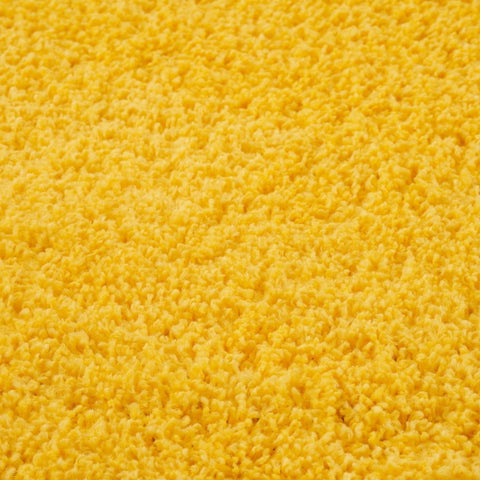 Bright yellow plush shaggy carpet with soft textured surface from myshaggy solid yellow rug collection