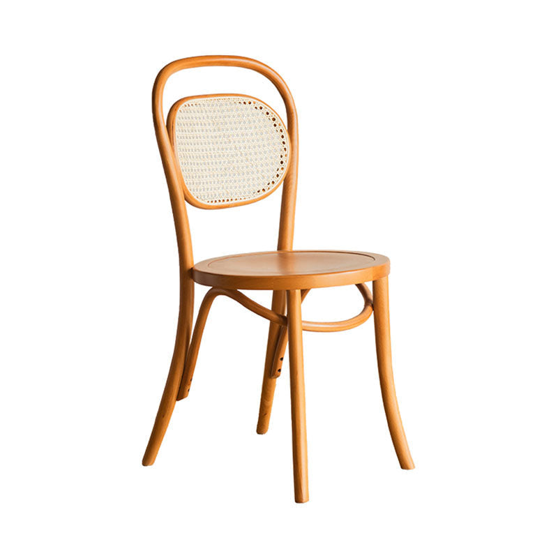Light brown nadia rattan dining chair with curved backrest and woven cane seat perfect for dining rooms