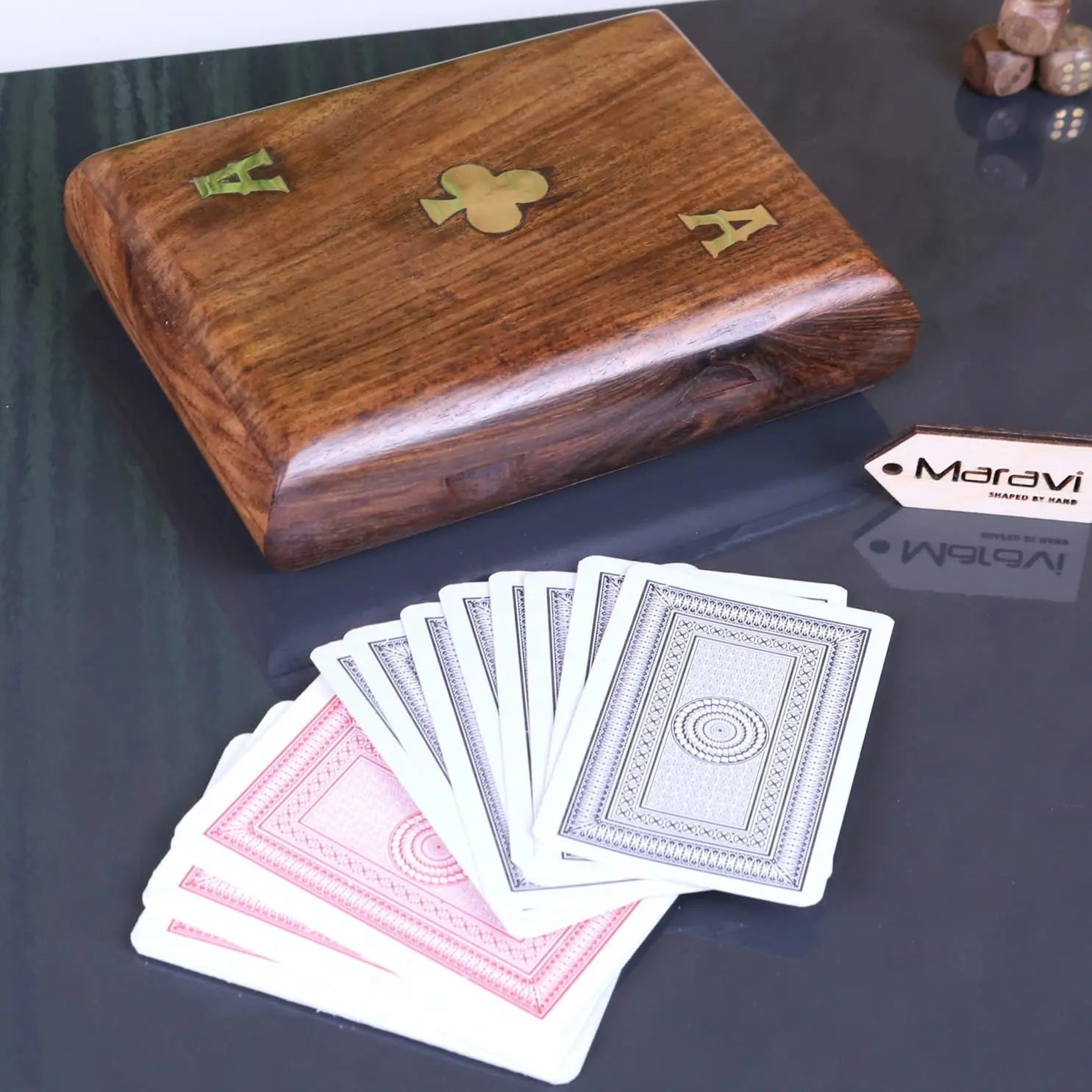 Brown wooden Nadu double playing card box with gold inlaid ace and a fan of assorted playing cards