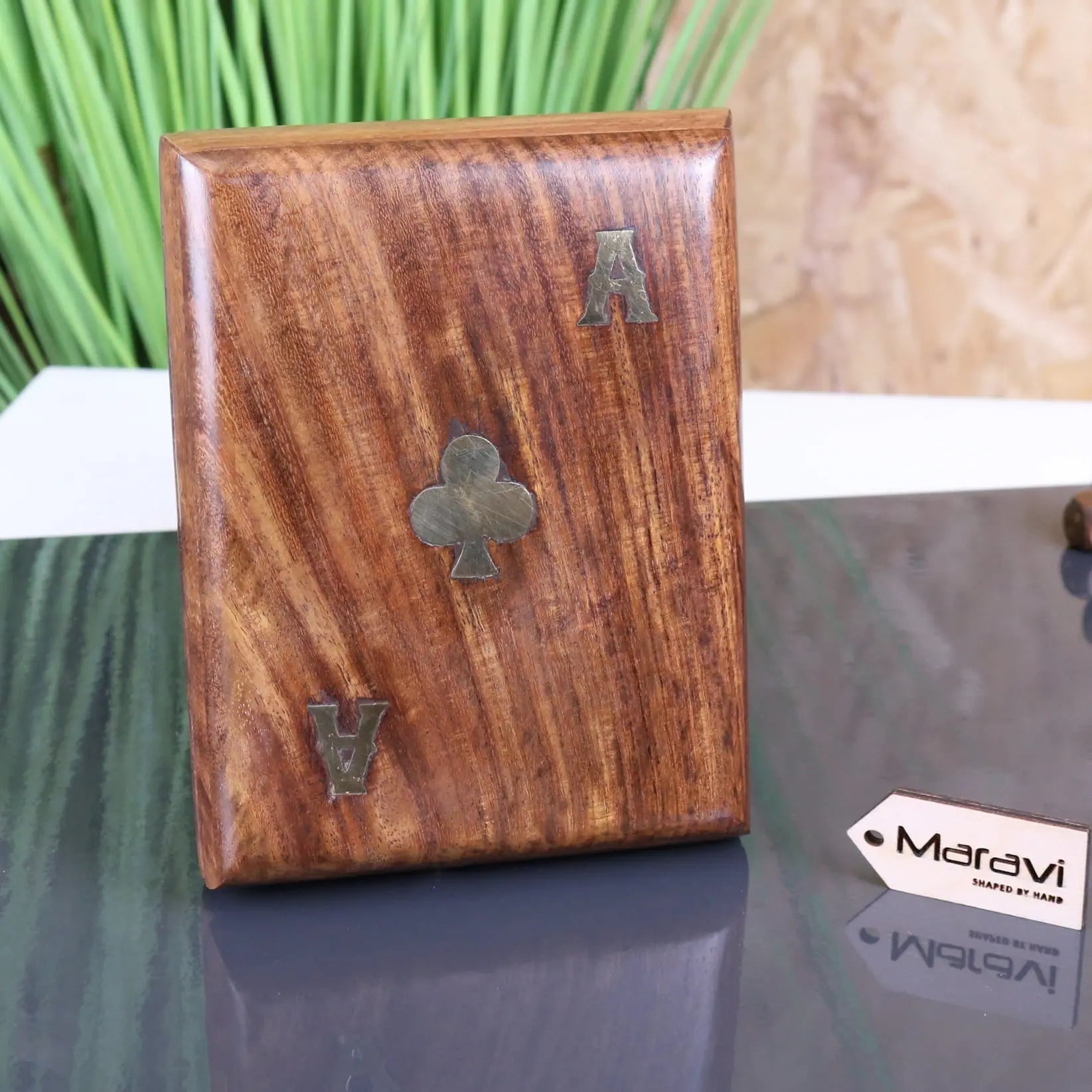 A polished warm brown wooden playing card box with engraved silver card symbols from nadu double wooden card box