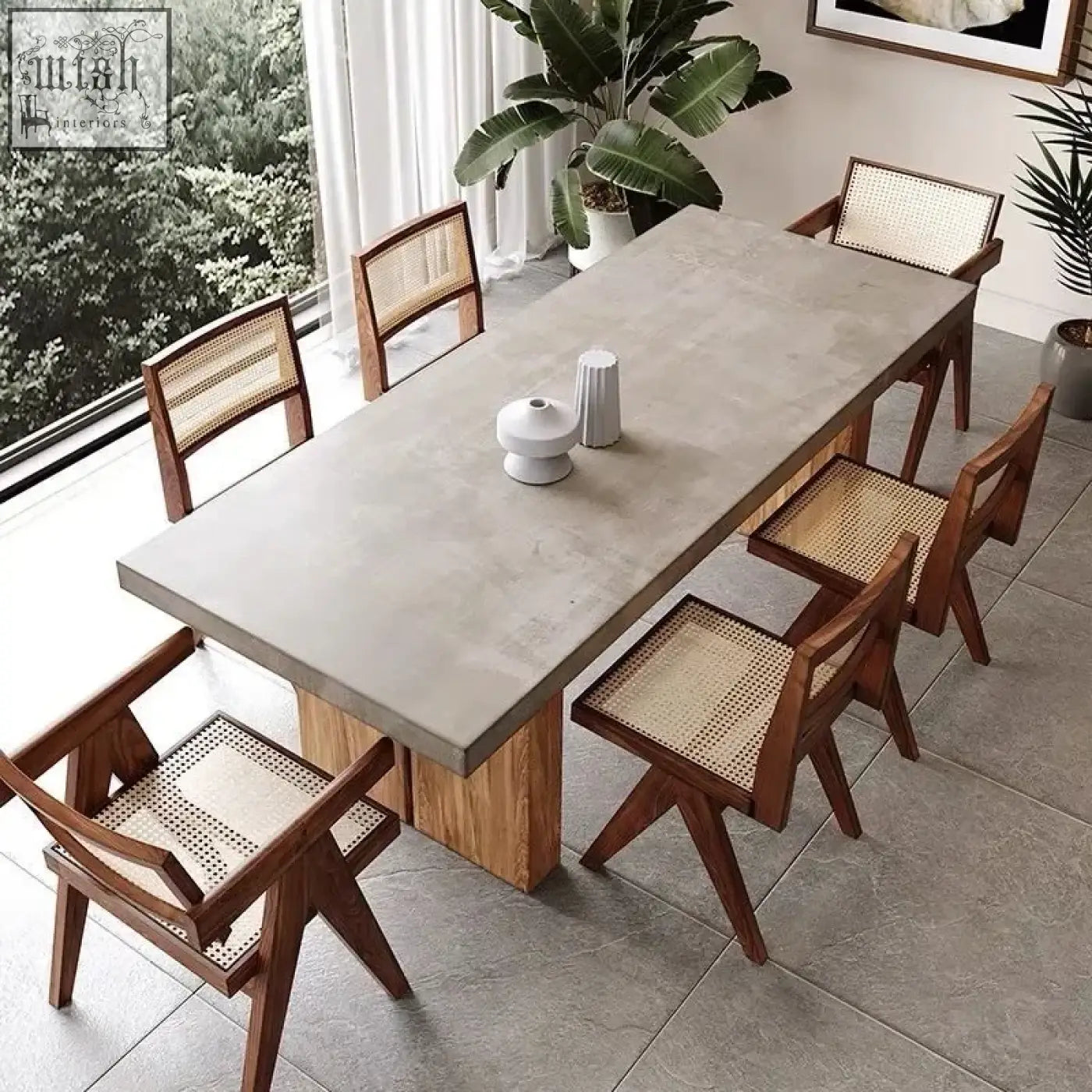 Concrete nakamura dining table with wooden legs and matching cane-backed chairs for stylish dining spaces