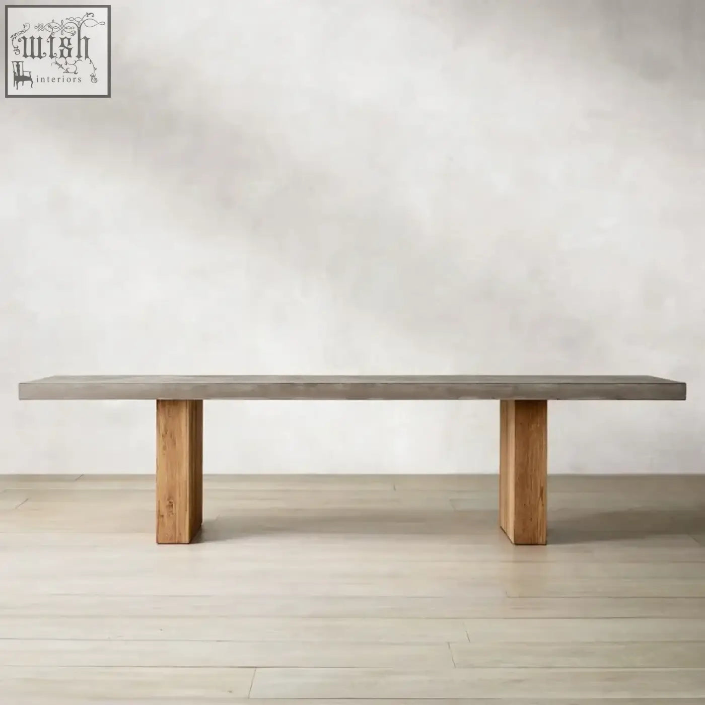 Modern concrete top bench with sturdy wooden legs complementing the nakamura dining table setup